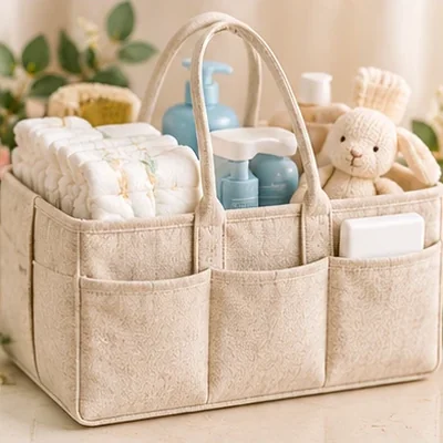 Fabric diaper caddy organizer filled with baby essentials