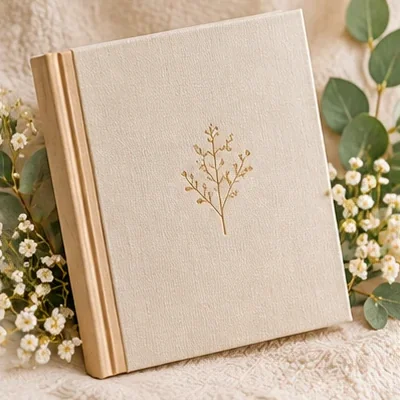 Cream linen baby memory book with a gold leaf design