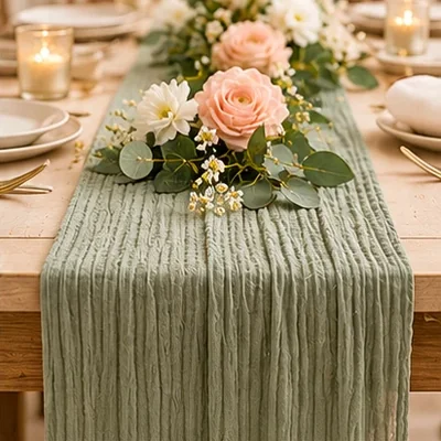 Sage green table runner on a set table